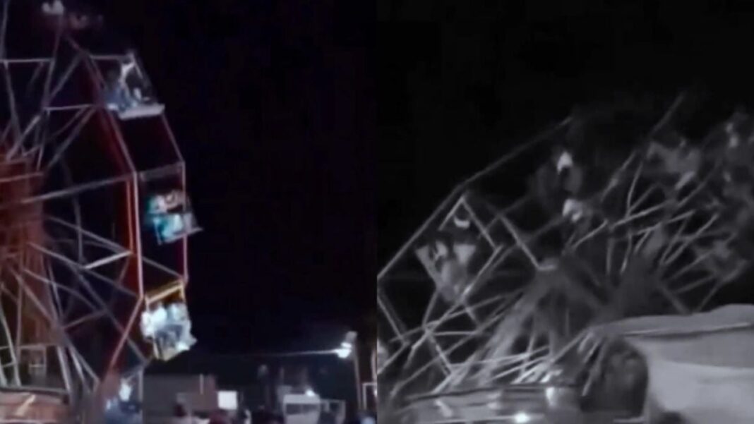 Restos de una rueda de la fortuna colapsada en un parque de diversiones de India, con personal de emergencia en la zona.